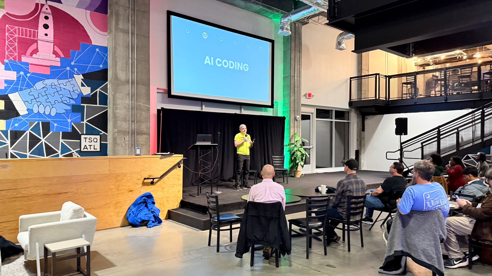 Andrew Tabit presenting on stage